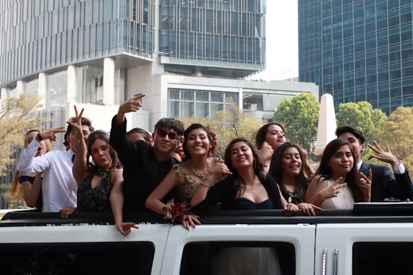 Happy customers enjoying luxury limousine service from transportcenterhub.xyz during a memorable event.